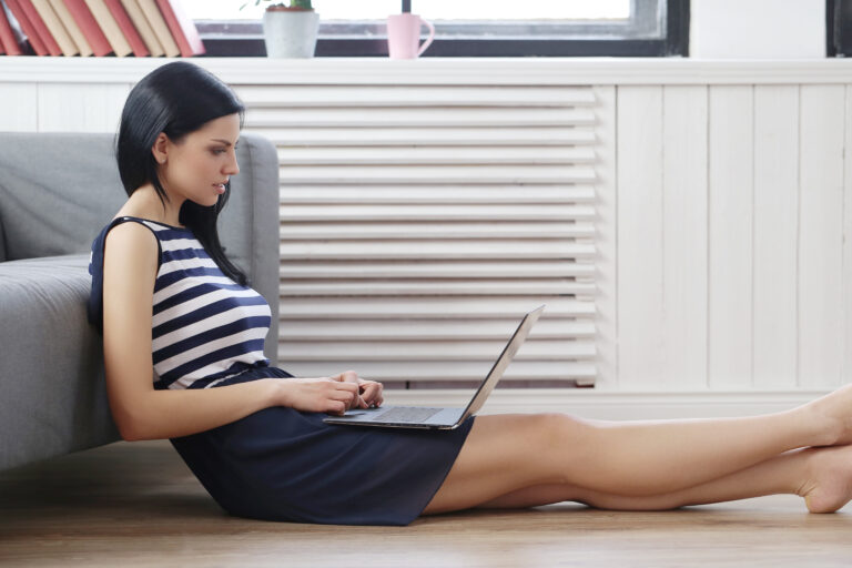 Homeowner relaxing and breathing easy in a bright, clean-air living room.